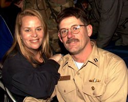 Mary Chapin Carpenter poses with Lt. Max J. Wildermuth during a USO show.