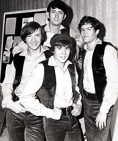 Early promotional photo of The Monkees on the set of the pilot, 1965